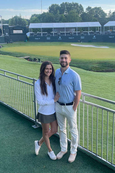 Samantha Large with her husband on the golf course